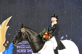 Isabell Werth on a horse at the Olympics