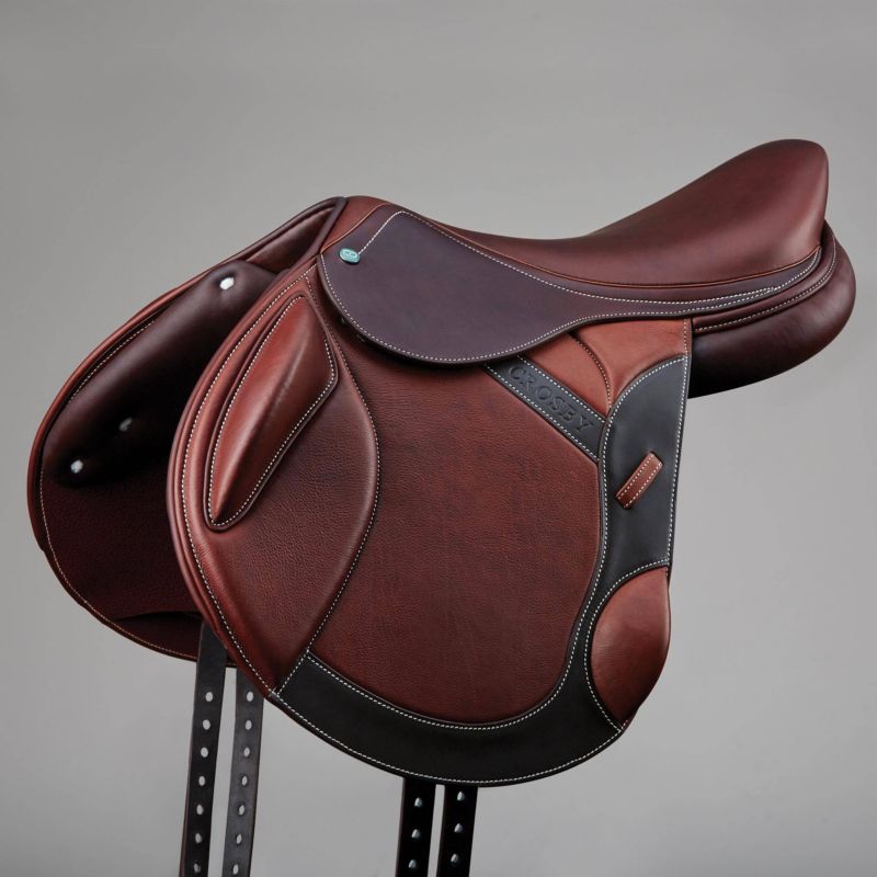 "Brown Prestige showjumping saddle with intricate stitching details."