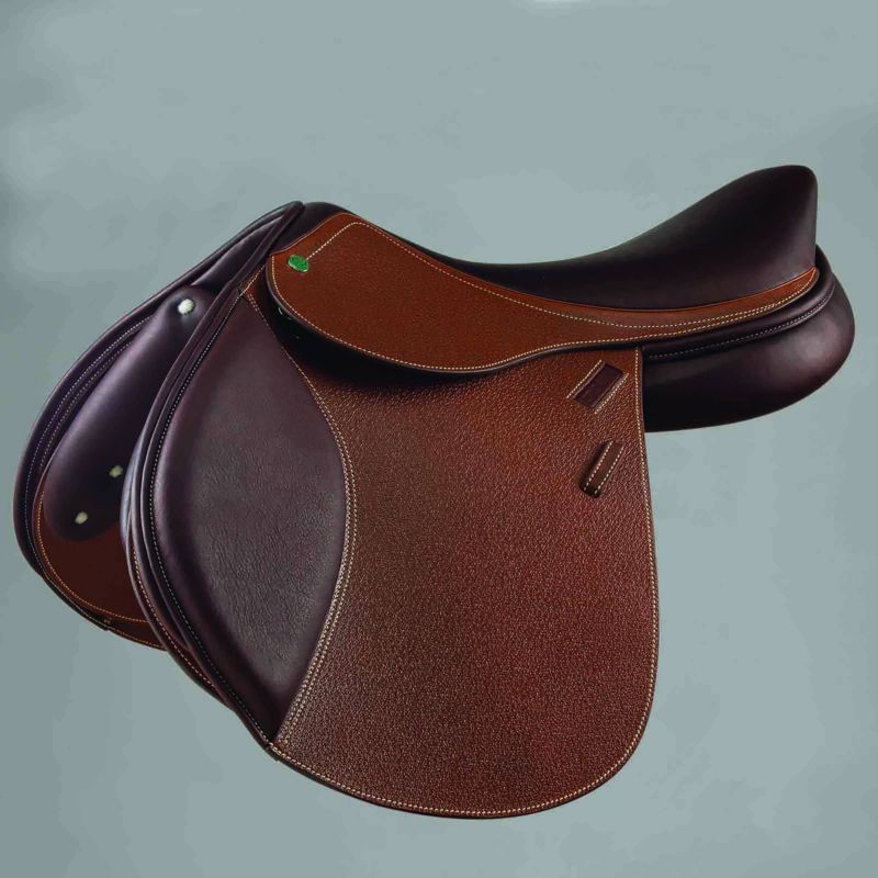 Dark brown showjumping saddle with green logo on flap.