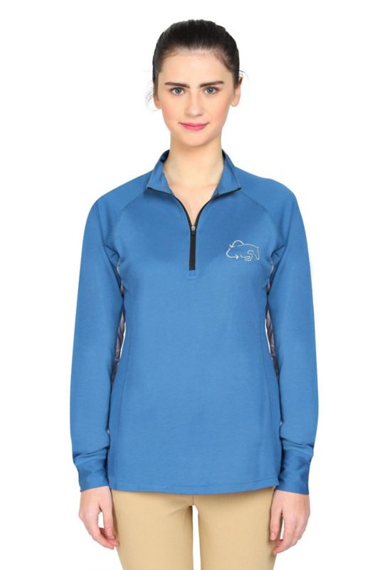 Woman wearing blue Tuffrider quarter zip equestrian shirt.