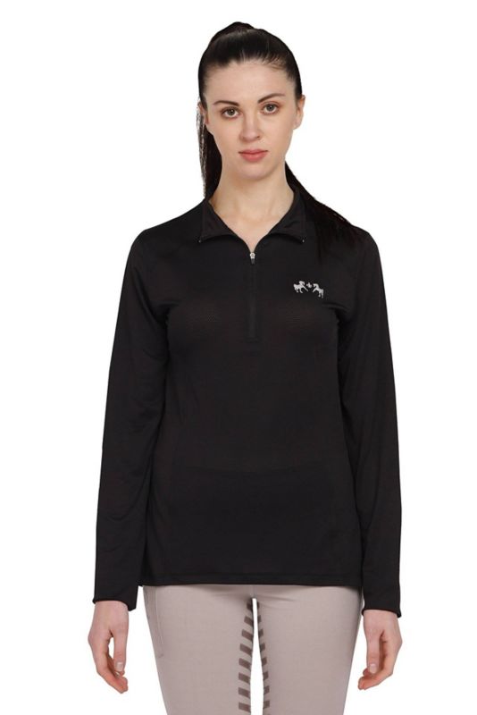 Woman wearing black Tuffrider long-sleeve polo shirt, white background.