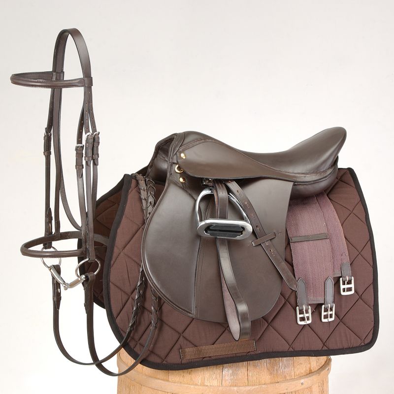 Brown all-purpose saddle with bridle on stand.