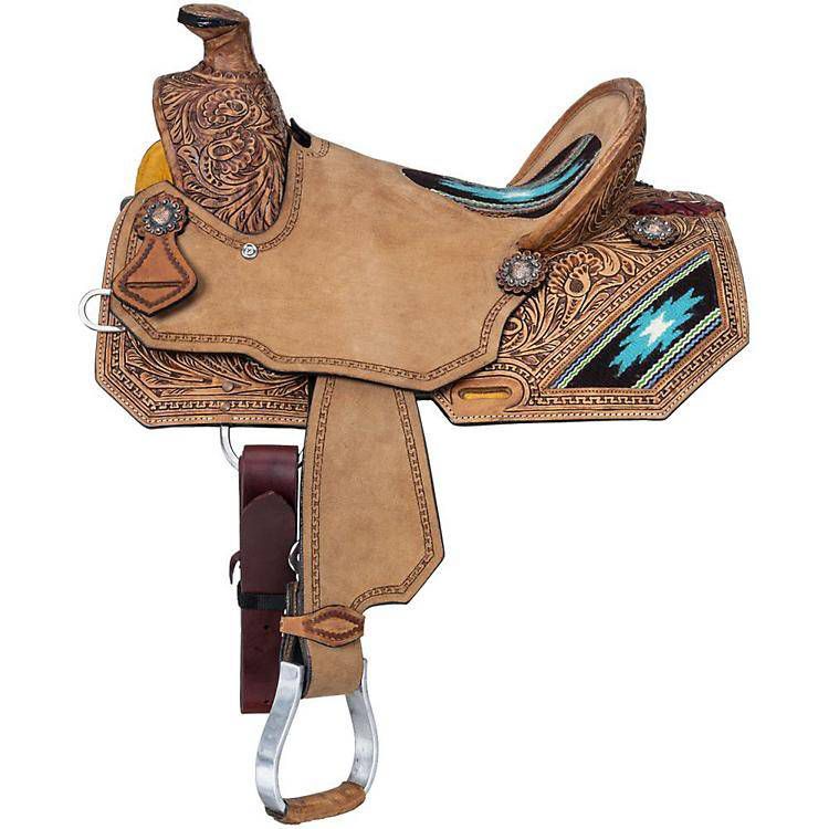 Ornate western saddle with intricate leather designs and silver accents.