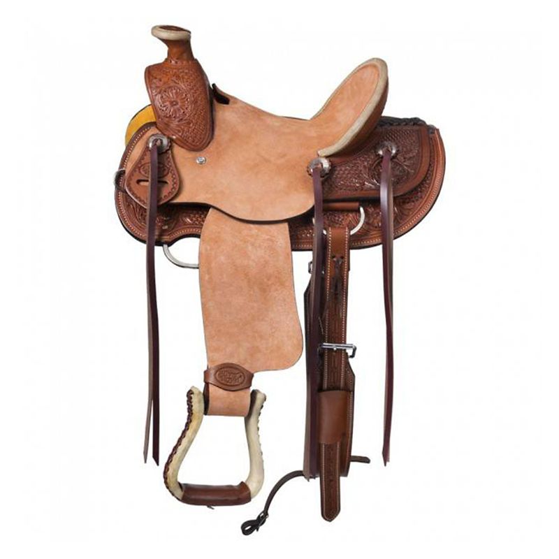 Tan leather western saddle with intricate tooling and decorations.