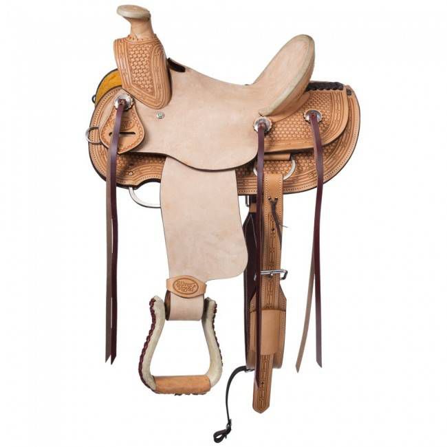 Tan leather western saddle with intricate tooling and stirrups.